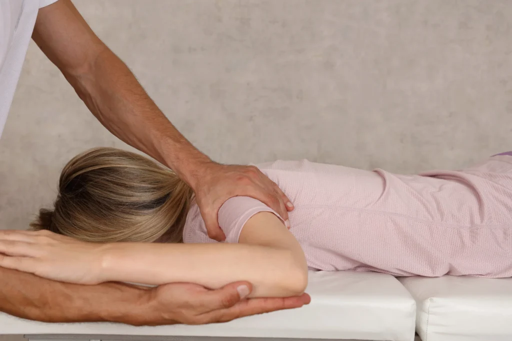 Shoulder impingement Woman getting help with shoulders