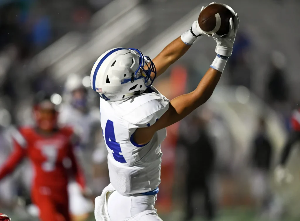 A football player making a catch after a successful Bankart repair